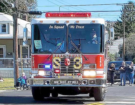 Drivers from Ogdensburg steer the Firetruck toward the Memorial Pavilion and Park.