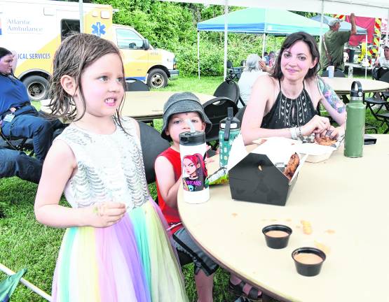 Autumn, Dante and Erika Kane of Vernon sit down food.