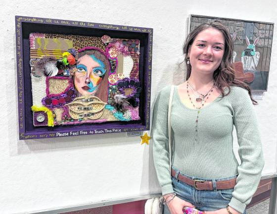 Ashley Caraccio is shown with her scholarship-winning piece.