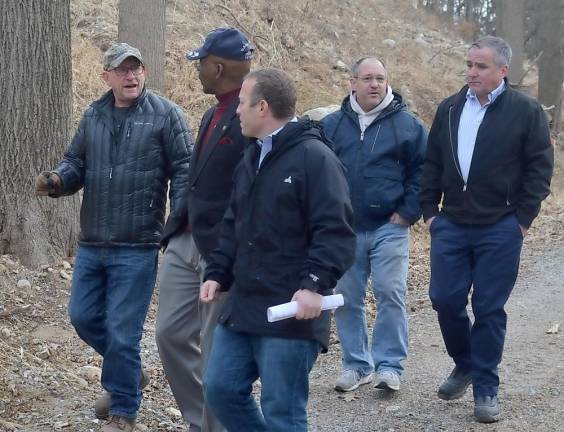 Vernon Township Council President Harry Shortway speaks with Mayor Howard Burrell and U.S. Rep. Josh Gottheimer at the dump site in February, while PAID chairman Martin O'Donnell talks to Assemblyman Hal Wirths (Photo by Mike Zummo)