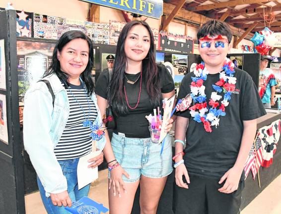 <b>Maria, Brislin and Alexander Lagunes of Sussex pose for a photo.</b>