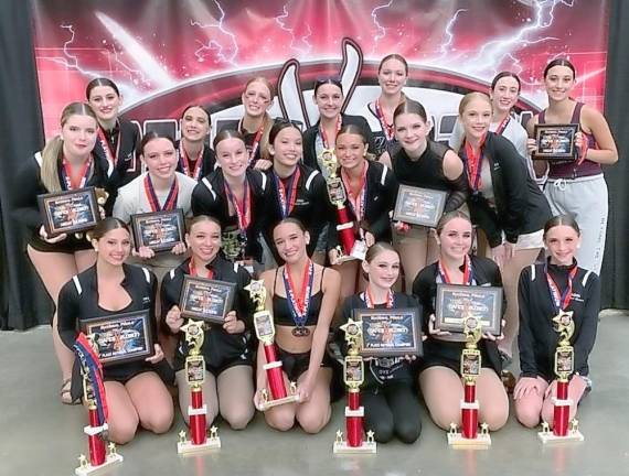Dance Expression shows off its trophies and awards.