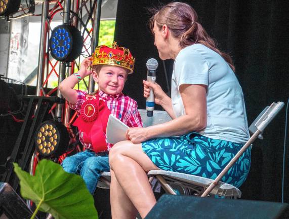 <b>Little Mister Hamburg Mason Brunda is interviewed by Jessica Jansen during the Little Royalty presentation Tuesday, Aug. 5. (Photo by Nancy Madacsi)</b>