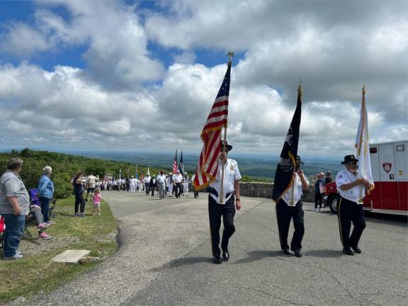 Members of the American Legion follow the flag bearers to the New Jersey Veterans’ Memorial in High Point State Park. (Photo by Daniele Sciuto)