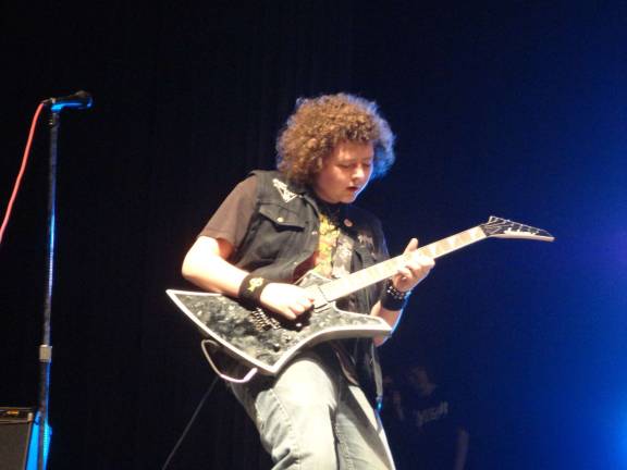 Photo by Scott Baker Asylum guitarist Mike Sokolwski shreds a guitar solo during a popular cover song.
