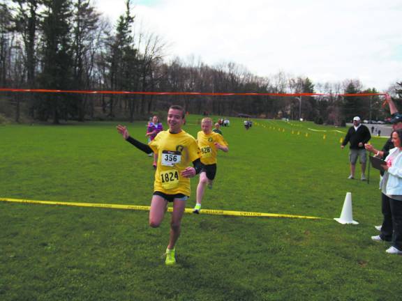 Dillon Whitley, 14, of Hardyston and Nick Boyle, 14, of Hardyston finish 1st and 2nd in the 100 yard dash in the Kids Fun Run event.