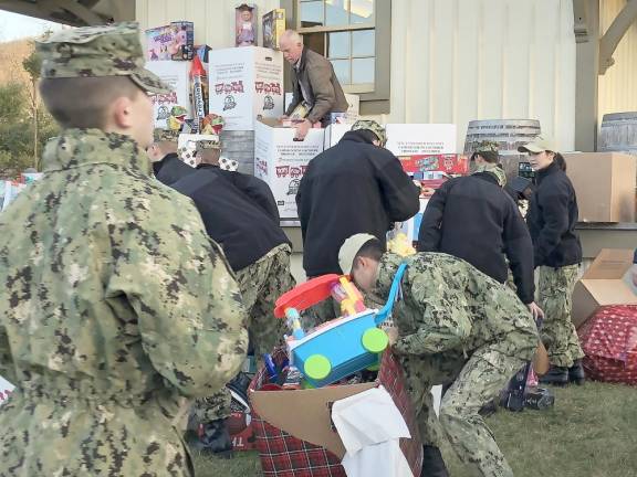 Donated toys are loaded at the Sparta Station.