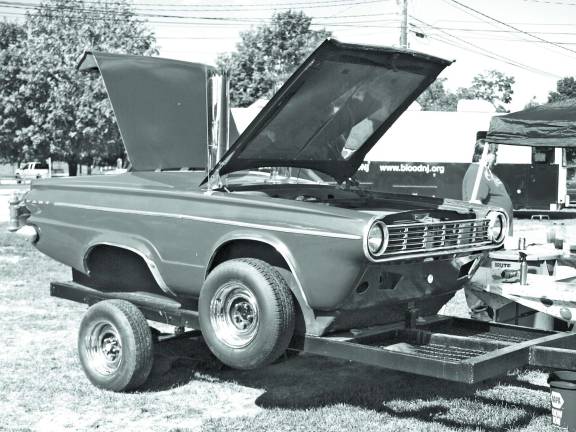 A 1960's era Dodge Dart 'Car-B-Cue' grill made by Fred Kelly, of Greeley, Penn. The car has a cooking grill where the engine should be.