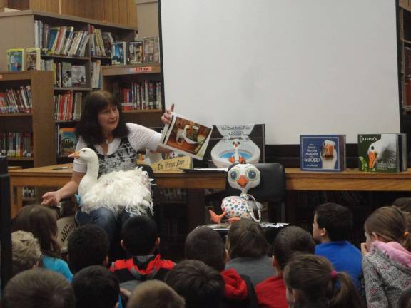 Vernon children's author Leesa Beckmann reads &quot;Oliver's search for Miss Matilda and the Murky Mud Puddle&quot; to the entire third-grade class at Franklin Elementary School.