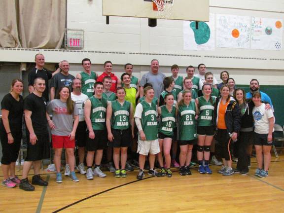 Faculty-alumni game raises $540 for eighth-grade class