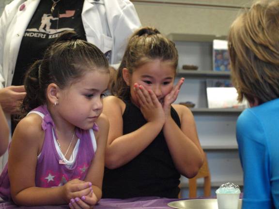 Alexxa Schlereth, left, 6, of Hardyston, and Jessyca Schlereth, 6, of Franklin watch baking soda and vinegar react.