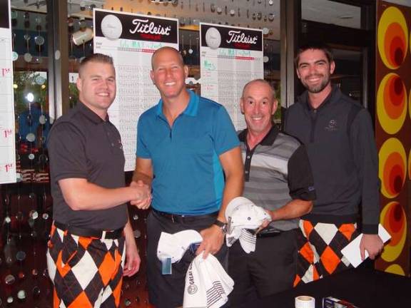 Champs Glen Rasin and Joshua Massler receive their prizes from GM Dan Hintzen and Erik Wefer.