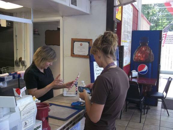 June Martin serves a customer at Jersey Dog.