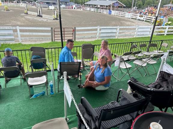 Lori Eckert, front, is president of the committee that raised money for temporary box seats at the New Jersey State Fair. Behind her are Todd Demming, co-vice president, and Rebecca Demming.