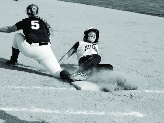 Photos by George Leroy Hunter A Jefferson Falcon slides to first base.