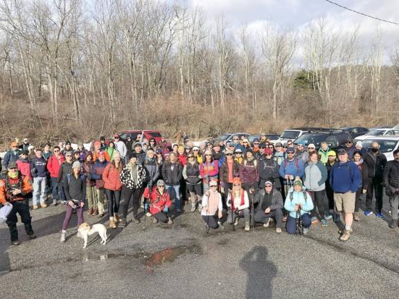 The hikers gather for a group photo before they begin.