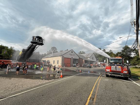 Neighboring fire departments stop by for a wetdown of the new ladder truck Saturday, Aug. 16 at Jefferson Township Fire Department Company 1.