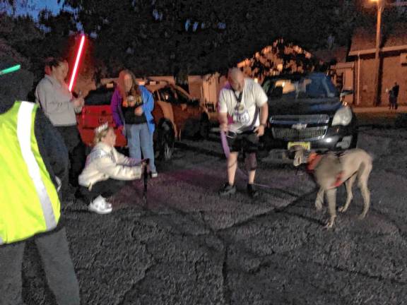 Miss Franklin, Chrystine Mowles, offers a medal to a four-legged finisher.