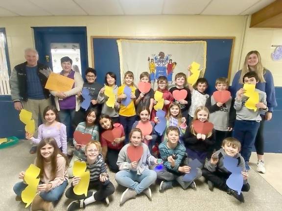 William Truran, top left; fourth-grade teacher Holly Romahn, second from top left; and teacher Madeline McMullan, top right, pose with fourth-graders at Hardyston Elementary School. (Photo provided by Hardyston School Principal Jennifer Cimaglia)