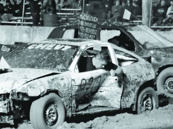 Chris Oursen of Sussex checks out door damage.