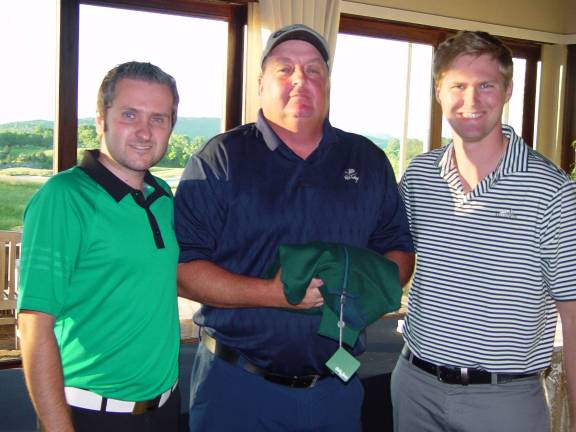 Bret Trenkman is awarded the Men&#xfe;&#xc4;&#xf4;s low gross prize by Ballyowen Golf Club&#xfe;&#xc4;&#xf4;s GM Mark Melillo and Kevin Wagoner