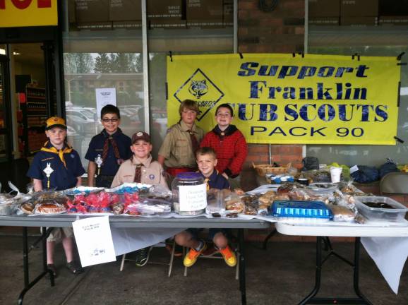 Cub scouts from Pack 90 recently raised money by conducting a bake sale.