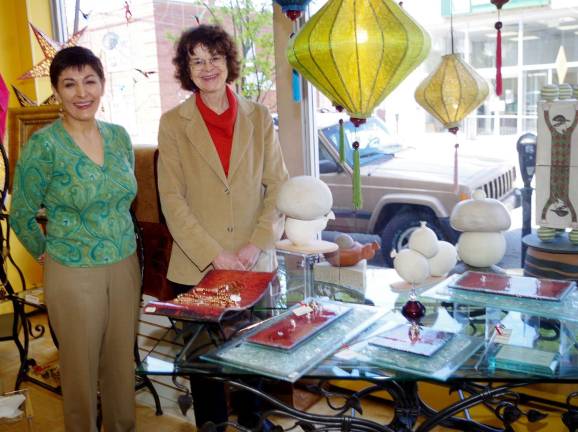 From the left, local artist Agatha Wyman and store owner Sussan Chakamian with a display of Wyman&#x2019;s ceramic pieces at the Silken Wool Home store in Warwick, N.Y.