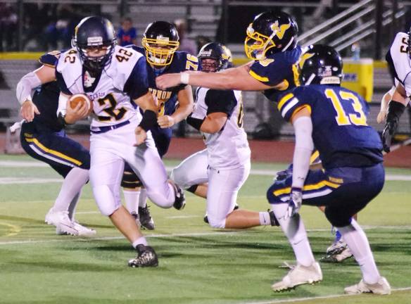Jefferson ball carrier Brandon Haid avoids Vernon defenders in the first half.