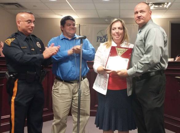 Shown from left are, Franklin Police Chief Eugene McInerney, Borough Councilman Nick Giordano, Borough Manager Allison Littell-McHose, and retiring Sgt. Leo Kinney.