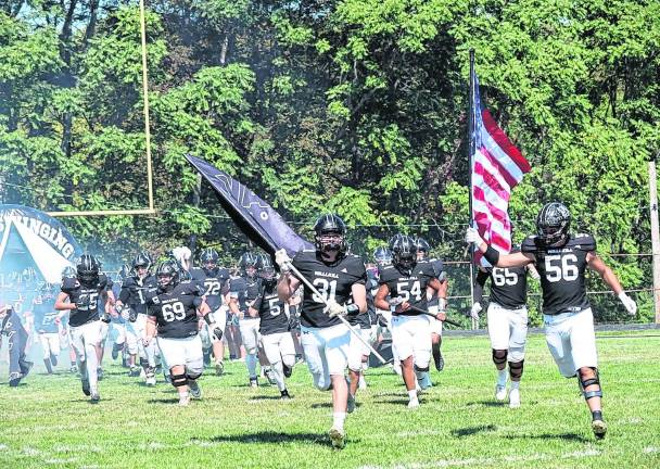 The Wallkill Valley football team takes the field.