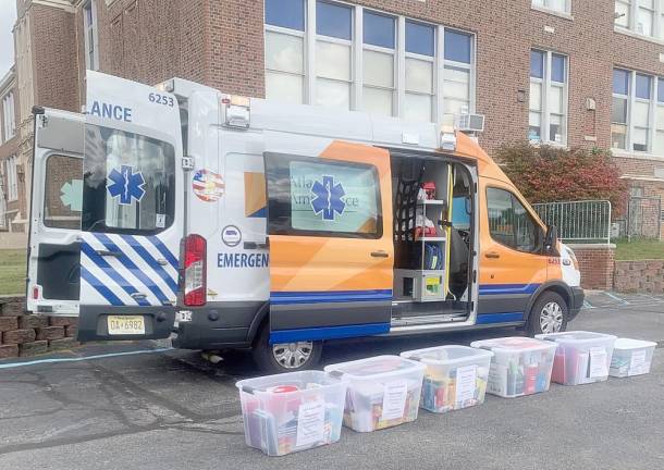 Six bins sit outside an ambulance at Franklin Borough School