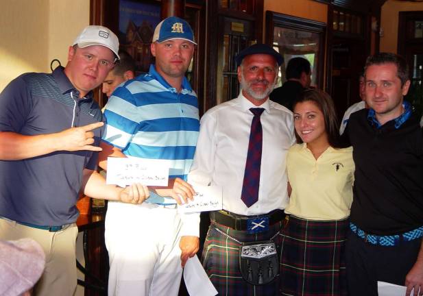 The winning team of Michael Cohen and Matt Post receive their prize from Mark Melillo the Ballyowen General Managers and club staffers.