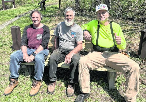<b>Volunteers Hal DeVoid of Wantage, left, Jeff Hookway of Lafayette and Tom Skevin of Andover Twp. enjoying their handiwork after rebuilding a bench recently for the Paulinskill Valley Trail Committee. This one, on the Sussex Branch trail off of Route 94 in Lafayette, is among several that volunteers have rebuilt.</b>