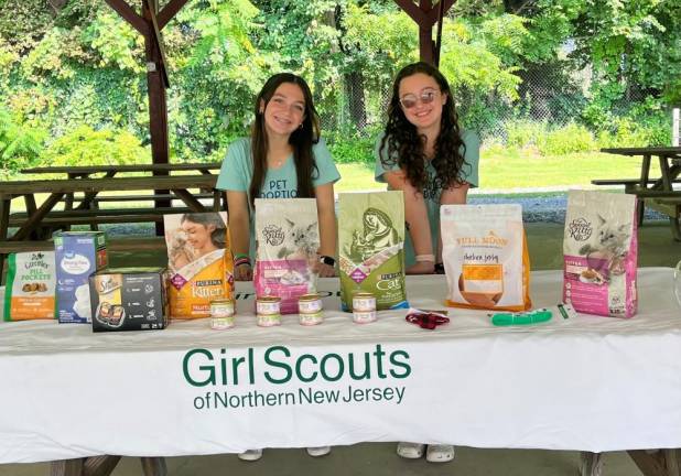 Bella Velasco, left, and Jenna Altieri hold a Pet Adoption Day for their Girl Scout Silver Award project. (Photos provided)