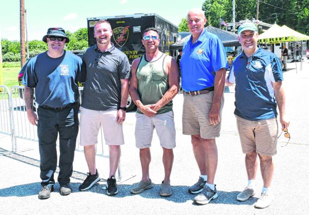 John Dixon, director of the SCCC Public Safety Training Academy, Cory Homer, SCCC president, County Commissioner Chris Carney, County Commissioner Alan Henderson and SCCC Foundation Exectuive Driector Stan Kula pose for a photo.