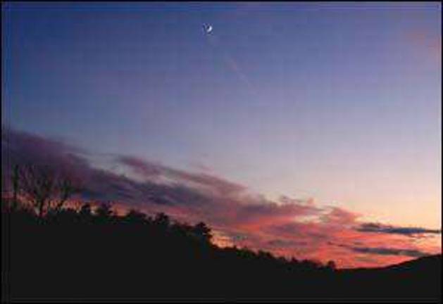 Sunset with crescent moon