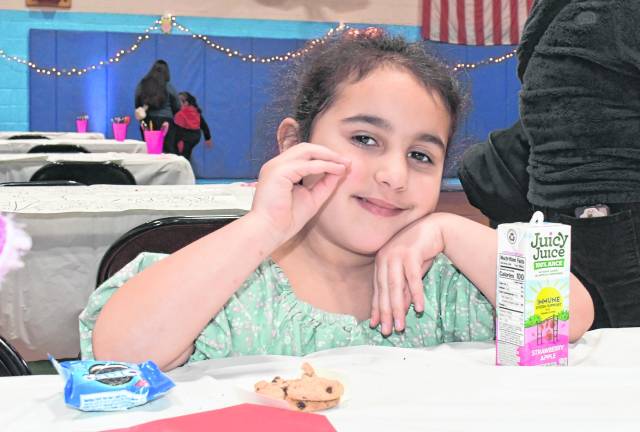 Nora Baez enjoys a snack.