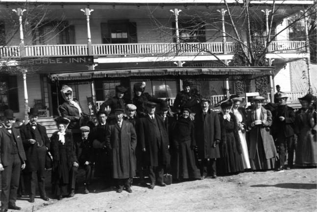 Travelers with bags and tickets outside the Goble Inn about 1905. (Photo provided)