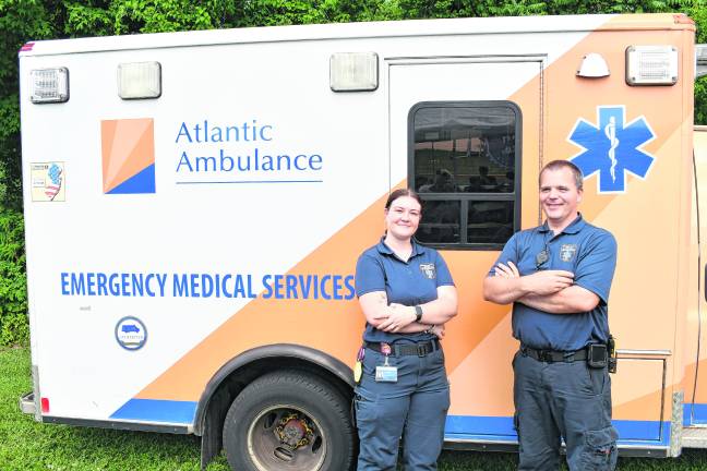 Lizabeth Muys and Joseph Atkinson of Atlantic Ambulance pose for a photo.