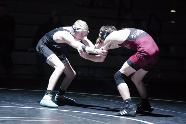 Wallkill Valley's Christian Westergaard, left, grapples with Pompton Lakes' Shane Kehoe in the 113-pound weight class. Kehoe won by decision, 5-4.