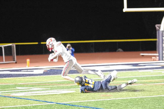 <b>After catching the ball, High Point wideout Mark Leach is brought down by Vernon cornerback James Curry in the fourth quarter. </b>