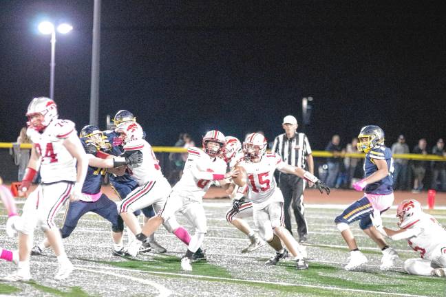 <b>High Point quarterback Jerry Empirio is about to throw the ball in the second half. He made one touchdown and passed for 120 yards.</b>