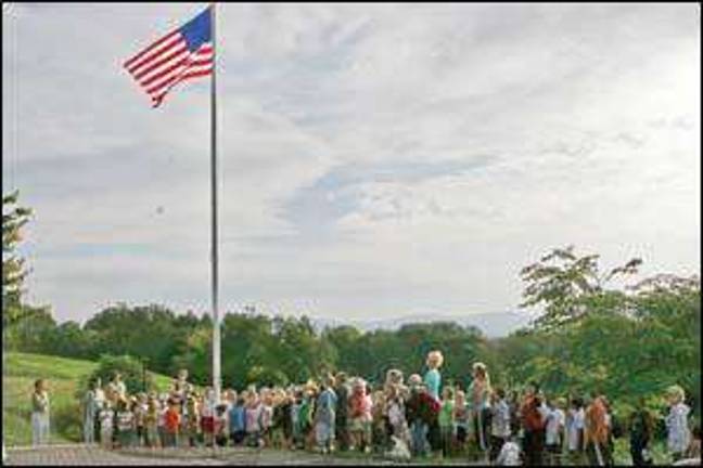 Praying at the flagpole