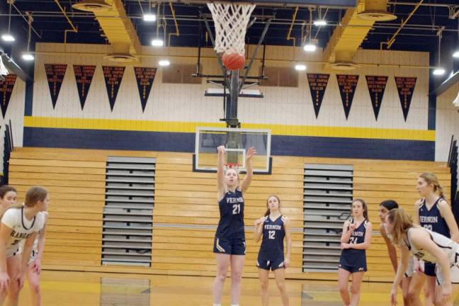 Vernon’s Chloe DeBonta (21) releases the ball from the foul line.
