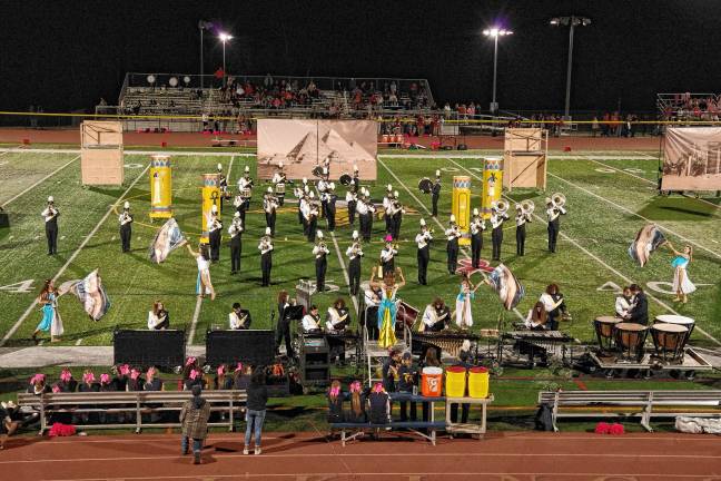 <b>The Vernon Township High School Marching Band and Color Guard perform during halftime. The performance theme was based on ancient Egyptian culture.</b>