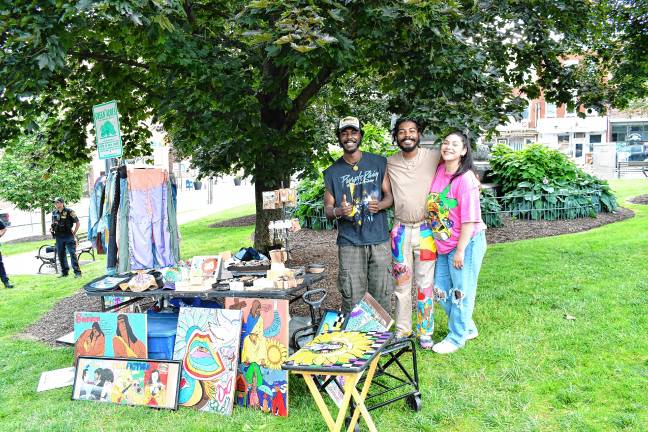 JN3 Robert and Arman Brown of North Plainfield show off the T Cozy brand clothing with Donna Sanchez of New Brunswick. (Photo by Maria Kovic)