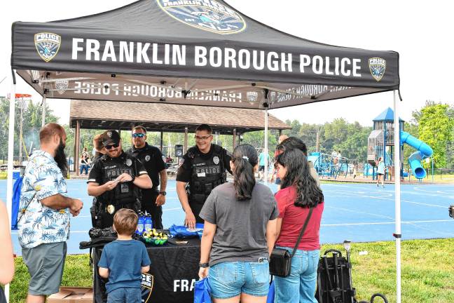 Residents talk to Franklin police officers during the National Night Out event Tuesday, Aug. 5 in Franklin.