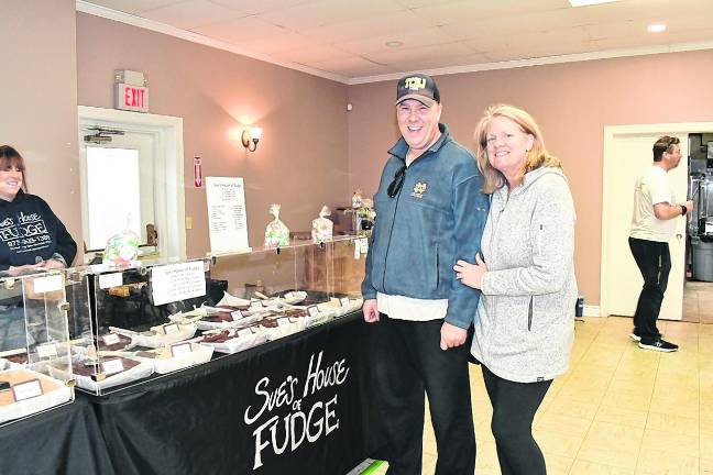 Susan and Mike Winge of Highland Lakes are shown by Sue’s House of Fudge.