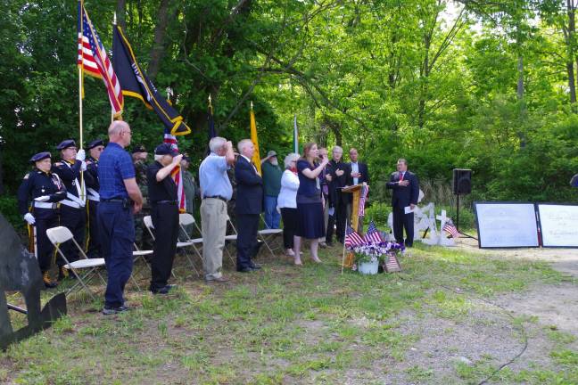 Photo by Chris Wyman Vernon resident Jennifer Behnke sings the Star Spangled Banner at the beginning of the groundbreaking ceremonies.