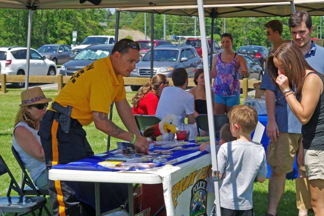 Vernon Police Patrolman Emanuel Rivera offered passers by free literature and handgun locks. He also shared information about one of the township's most popular websites: www.facebook.com/vernonpolice, which now boasts some 8,501 Likes up from 7,030 this time last year.